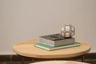 a stack of books and a lamp on a table at Tierra & Mar Ascensor Grupo AC Gestion in Cádiz