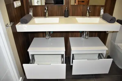 a bathroom with two sinks and two mirrors at Sweet Velázquez Apto. zona Playa Victoria in Cádiz