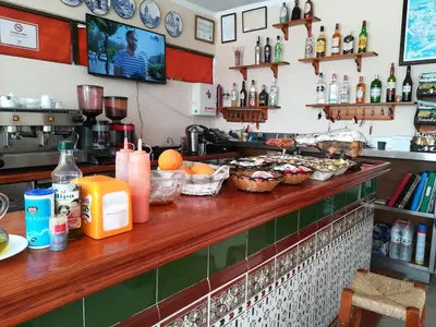 a kitchen with a counter with food on it at Vivienda Rural Alcazaba in Chipiona