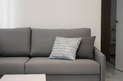 a bedroom with a bed with towels on it at Apartamento GRACIA by Cadiz4Rentals in Cádiz