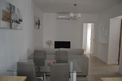 a living room with a couch and a table at Beautiful Central Cadiz in Cádiz