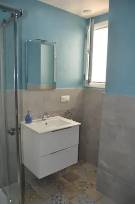 a bathroom with a sink and a shower at Beautiful Central Cadiz in Cádiz