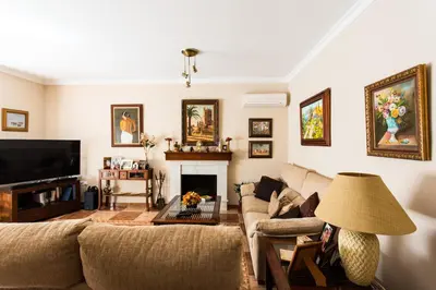 a living room with a couch and a fireplace at Dunas villa in El Puerto de Santa María