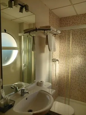 a bathroom with a sink and a shower at Hotel Las Canteras de Puerto Real in Puerto Real