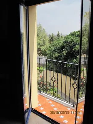 an open door to a balcony with a view at Hotel Caballo Negro in Puerto Real