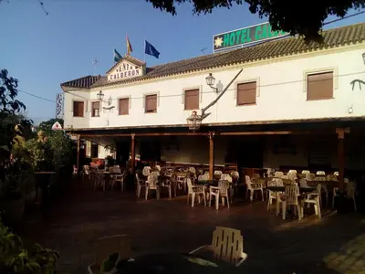 a restaurant with tables and chairs in front of a building at Hotel Restaurante Calderon in Arcos de la Frontera