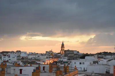 a view of a city skyline at sunset at Atardeceres Sureños - Gran Terraza - Parking in Jerez de la Frontera