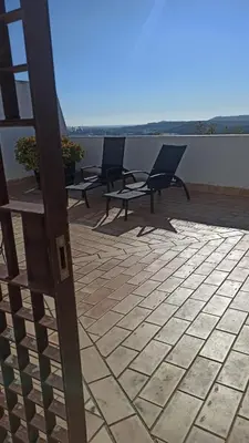 a group of chairs sitting on top of a patio at Atardeceres Sureños - Gran Terraza - Parking in Jerez de la Frontera