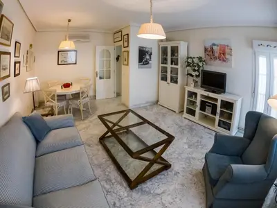 a living room with two couches and a coffee table at La Terraza del Drago in Cádiz