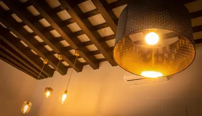a large light fixture hanging from a ceiling at CDZ - Poniente in Cádiz