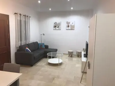 a living room with a couch and a table at Rincón en el Mentidero in Cádiz