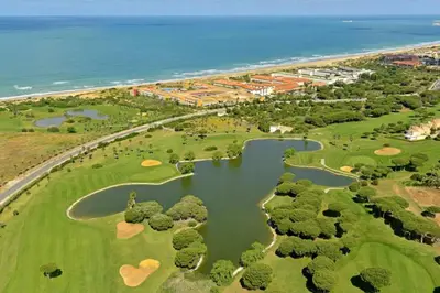 an aerial view of a golf course next to the ocean at COSTA EL CASTILLO Apartamento con WIFI in Chiclana de la Frontera