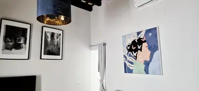 a room with three pictures on the wall at Levante by Gades Gestión in Cádiz