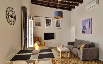 a living room with a couch and a table at Levante by Gades Gestión in Cádiz