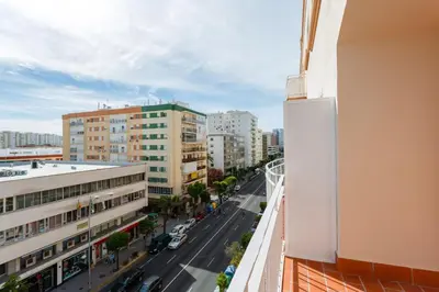 a view of a city street from a balcony at FARO Family Home by Cadiz4Rentals in Cádiz
