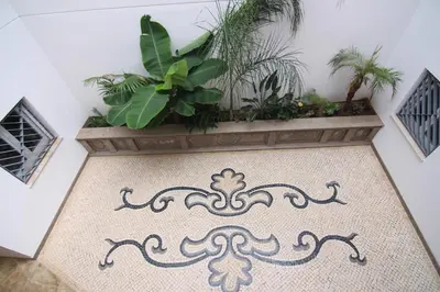 a hallway with a carpet with plants on it at El CONSEJERO de Indias free parking by Cadiz4Rentals in Cádiz