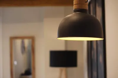 a black lamp hanging from a wall in a room at El CONSEJERO de Indias free parking by Cadiz4Rentals in Cádiz