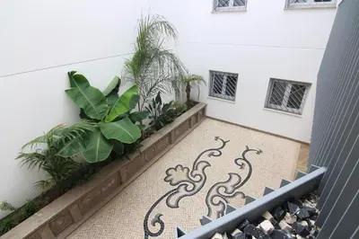 a staircase with plants in a building at El CONSEJERO de Indias free parking by Cadiz4Rentals in Cádiz
