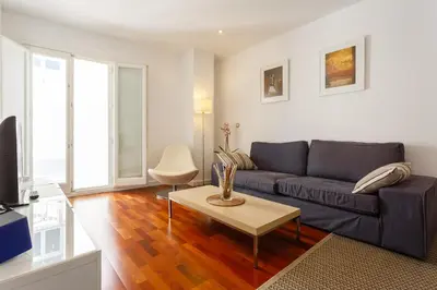 a living room with a couch and a table at Calderón De La Barca in Cádiz