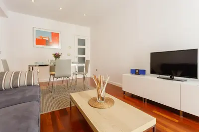 a living room with a couch and a tv at Calderón De La Barca in Cádiz