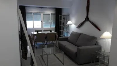 a living room with a couch and a table at GUESTING VELAZQUEZ in Cádiz