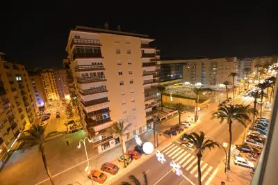 an aerial view of a city at night at GUESTING VELAZQUEZ in Cádiz