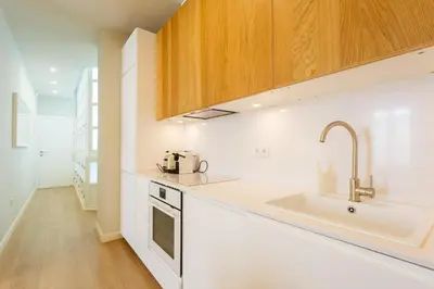 a kitchen with a sink and a counter top at Diseño y confort junto a la catedral in Cádiz