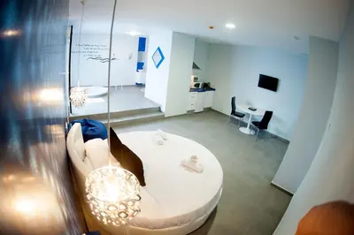 a living room with a couch and a table at Apartamentos Turísticos La Boutique del Mar in Conil de la Frontera