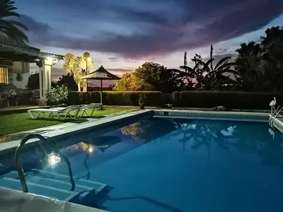 a swimming pool in the yard of a house at Bungalow Cuesta de la Rosa. Casita rural con encanto y vistas in Arcos de la Frontera
