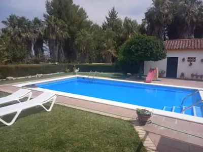 a swimming pool in the backyard of a house at Bungalow Cuesta de la Rosa. Casita rural con encanto y vistas in Arcos de la Frontera