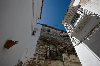 an old building with a window on the side of it at Bungalow Cuesta de la Rosa. Casita rural con encanto y vistas in Arcos de la Frontera