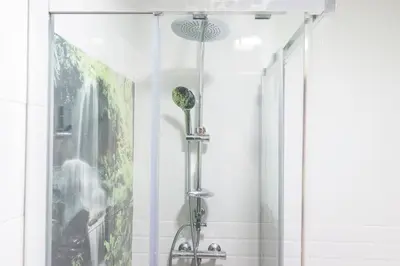 a shower with a glass door in a bathroom at Apartamento Patri in Jerez de la Frontera