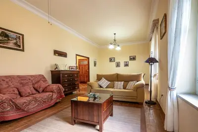 a living room with a couch and a coffee table at Gran Apartamento Avenida 57 in Cádiz