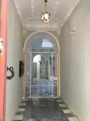 an entrance to a room with a glass door at Apartamento nuevo en casa tipo palacio in Cádiz