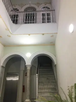 a staircase in a building with a balcony at Apartamento nuevo en casa tipo palacio in Cádiz