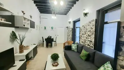 a living room with a couch and a table at Apartamento Levante in Cádiz