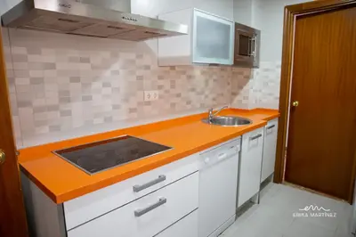 a kitchen with an orange counter top and a sink at Apartamento Pale Cream MRZ Rentals in Jerez de la Frontera