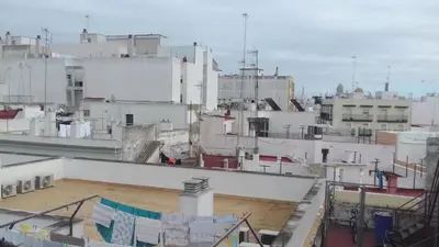 a view of a city with white buildings at La casa del dibujante in Cádiz