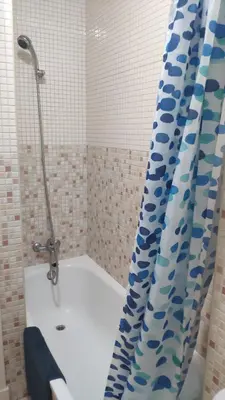 a bathroom with a shower and a tub with a shower curtain at Apartamento El Gaditano Errante in Cádiz