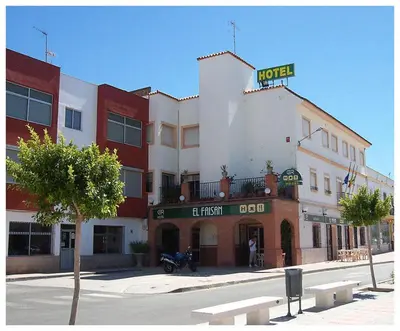a hotel with a sign on top of it on a street at El Faisan C&R Hotel in Arcos de la Frontera
