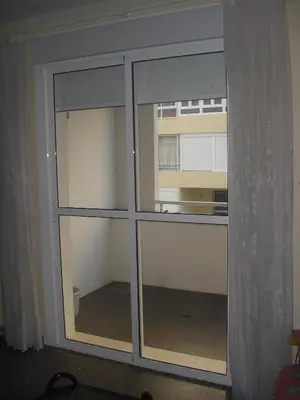 a glass door with a window in a room at Azul Maritimo in Cádiz