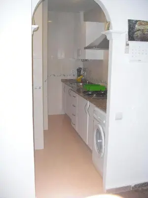 a kitchen with a washer and a washing machine at Azul Maritimo in Cádiz