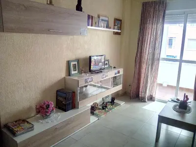 a living room with a television on a wall at Azul Maritimo in Cádiz