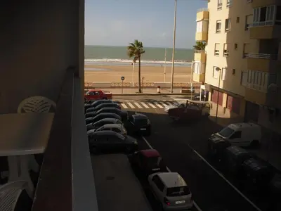a view of a parking lot with a beach at Azul Maritimo in Cádiz