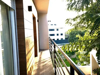 a balcony with a view of a building at Vivienda Avenida de la Manzanilla in Sanlúcar de Barrameda