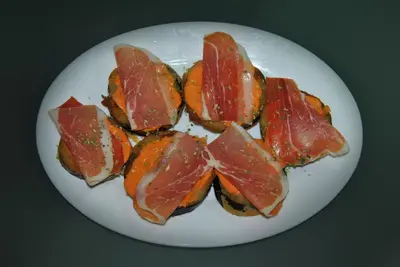 a white plate with a bunch of meat on it at Pensión San Marcos in Arcos de la Frontera