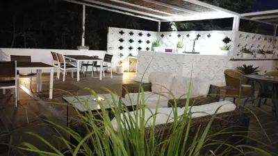 a room with tables and chairs and a table and chairs at Hotel Marisma Sancti Petri in Chiclana de la Frontera