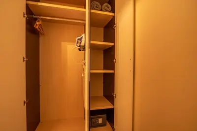 a walk in closet with a glass door at Hotel Los Nardos in Chipiona