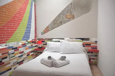 a bedroom with a bed with towels on it at Downtown house centro histórico in Arcos de la Frontera