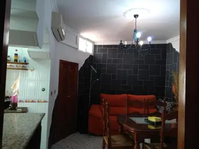 a living room with a couch and a table at Downtown house centro histórico in Arcos de la Frontera